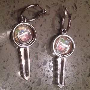 Earrings with letters “D” inside key shape